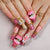 Kreatives Nagelset mit elegantem Tier- und Blütenmuster Brehn