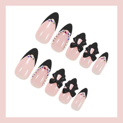 Kunstnagelset mit glamourösem Schleifen-Design und glitzernden Akzenten Brehn