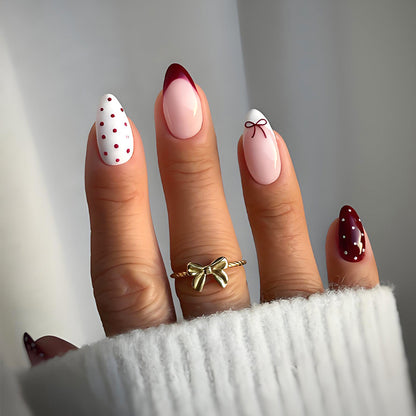 Kunstnagelset mit eleganten Schleifen- und Punktemotiven Brehn