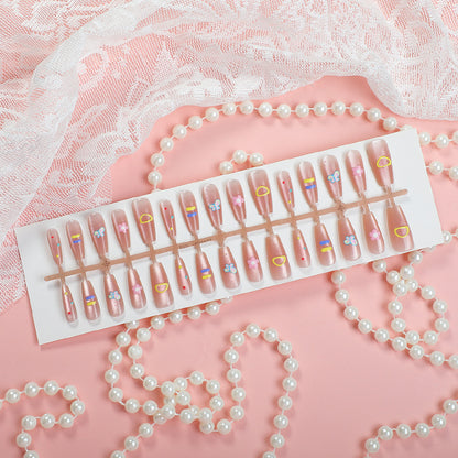 Dekoratives Press-On Nagelkunstset mit floralen und gemusterten Designs
