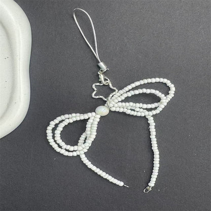 Dekorativer Perlen Schleifen Handy Charm Brehn