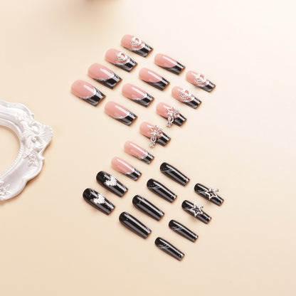 Künstlerisches langes Press-On-Nageldesign mit Strassakzenten Brehn