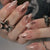 Künstlerisches Press-On Nail Set mit Stern- und Perlenakzenten Brehn