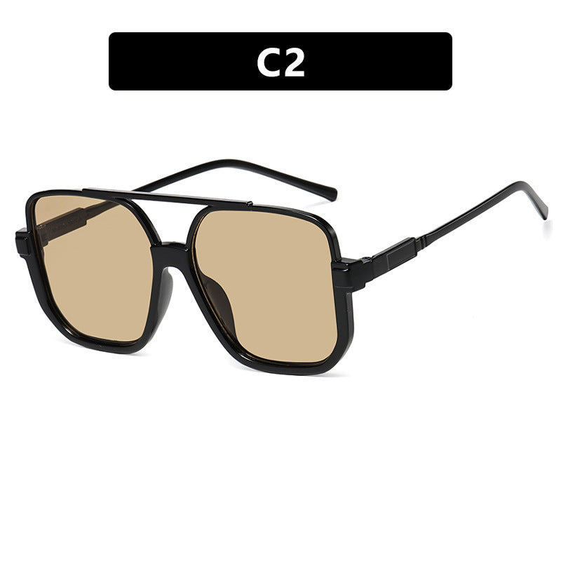 Damen quadratische Sonnenbrille mit transparentem Rahmen und grün getönten Gläsern Brehn