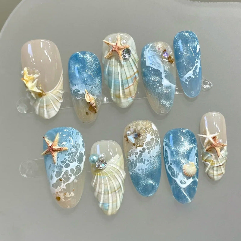 Kunstnägel mit maritimem Muschelmuster Brehn