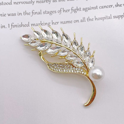 Elegante Brosche mit Glitzerstein und Perle Brehn