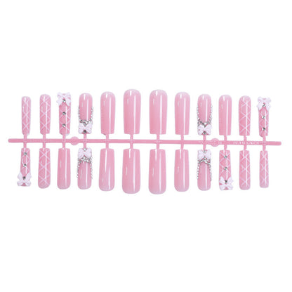 Kunstnagelset mit eleganten Schleifen- und Glitzerakzenten Brehn