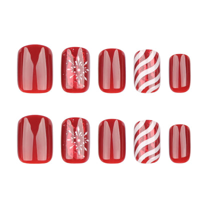 Kunstnagelset mit festlichen Designs und Glitzerakzenten Brehn