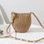 Damen Handtasche aus geflochtenem Naturmaterial mit Muschelverzierungen Brehn