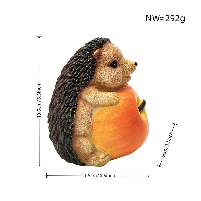 Niedliche Igel Skulptur mit Obst Brehn