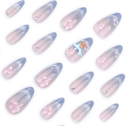 Kunstvolle Nagelverlängerungen mit elegantem Ombré-Design und floralen Akzenten Brehn