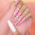 Kunstnagelset mit floralen Verzierungen und Glitzerakzenten Brehn
