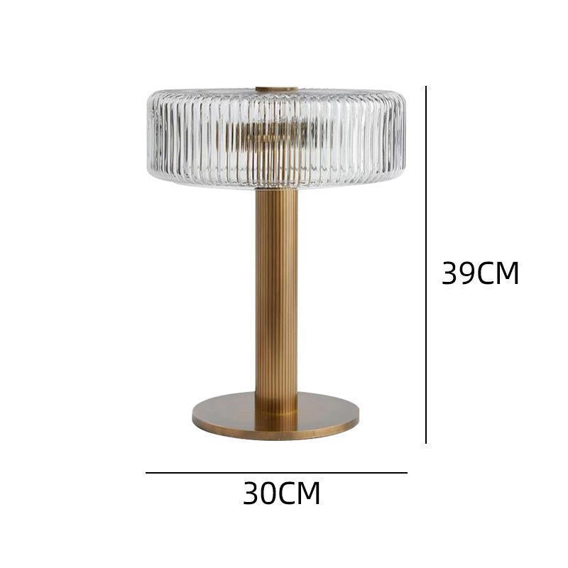 Elegante gerippte Glas- und Goldtischlampe