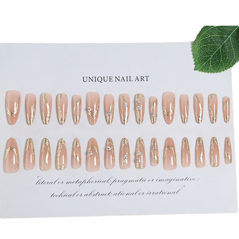 Kunstnagelset mit elegantem Gold-Design und funkelnden Applikationen Brehn