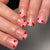 Kunstvoll gestaltete Nagelspitzen mit Herzmotiven Brehn