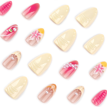 Kunstvolle Nagelverlängerungen mit floralen und perlenverzierten Akzenten Brehn