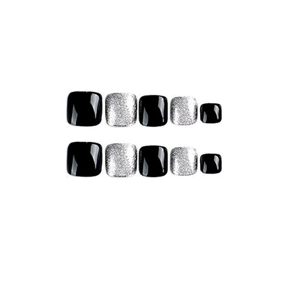 Kunstvolle Fußnagelkunst mit Glitzer- und Schwarzdesign Brehn