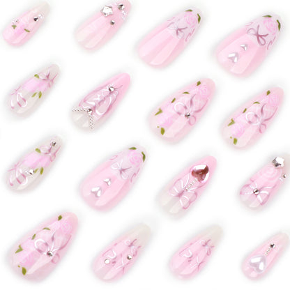 Kunstvolle Nagelkunst mit romantischen Rosen- und Schleifenmotiven Brehn