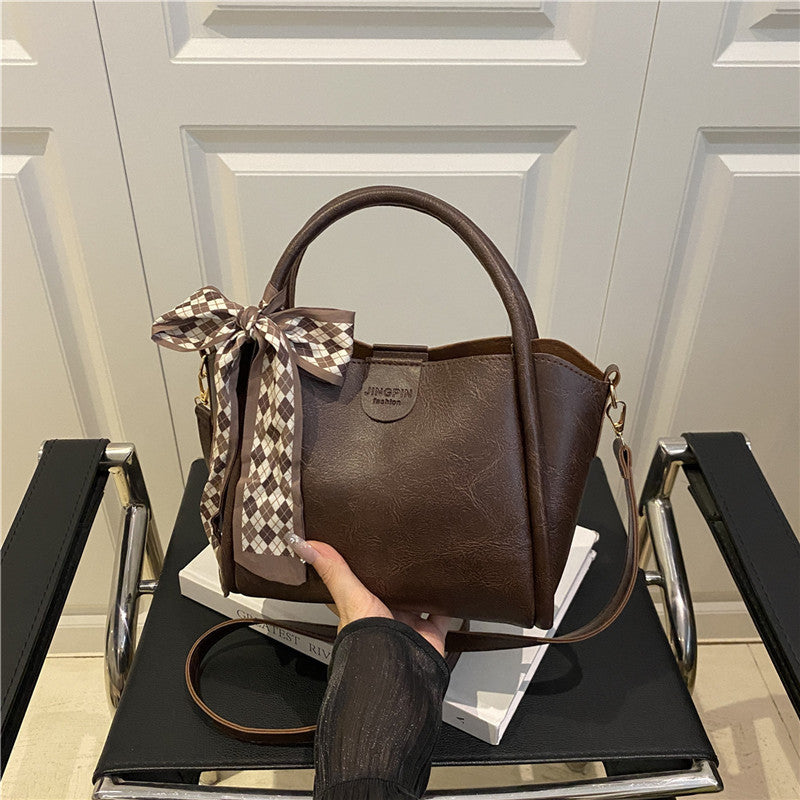 Elegante Schleifenakzent-Handtasche Brehn
