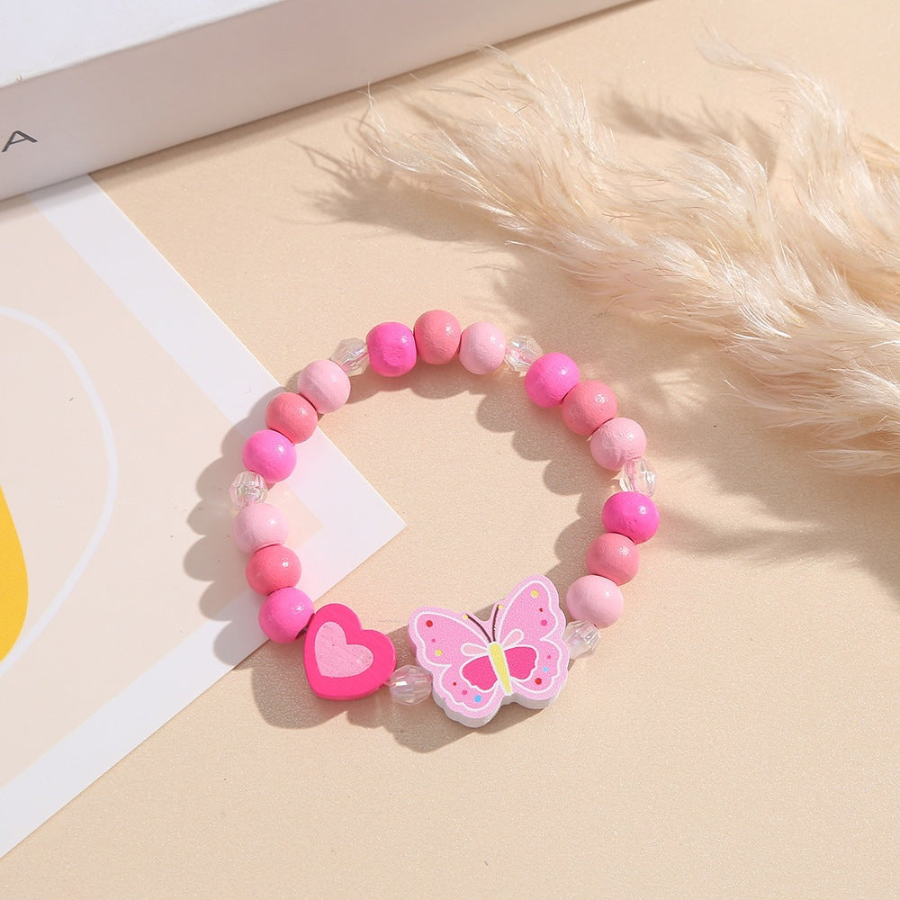 Verspieltes Armband mit Herz- und Schmetterlings-Anhängern Brehn