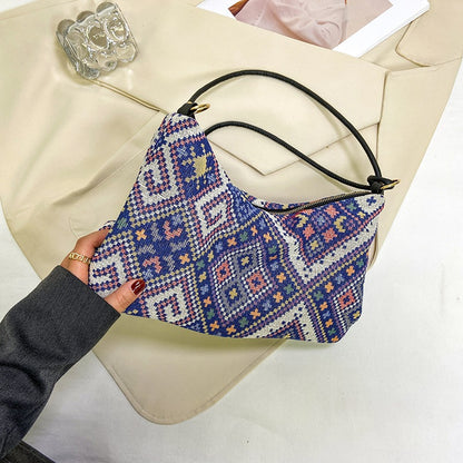 Gepunktete Schultertasche