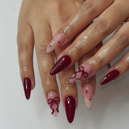 Kunstnagelset mit eleganten Schleifen- und Glitzer-Designs Brehn