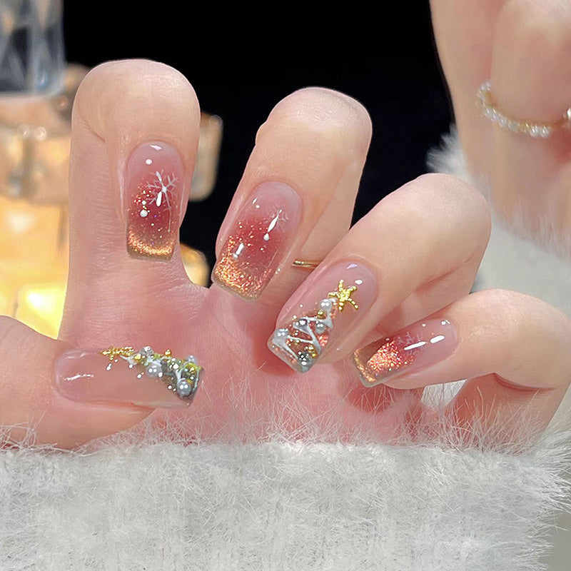 Kunstnagelset mit festlichem Weihnachtsmotiven und Glitzerapplikationen Brehn