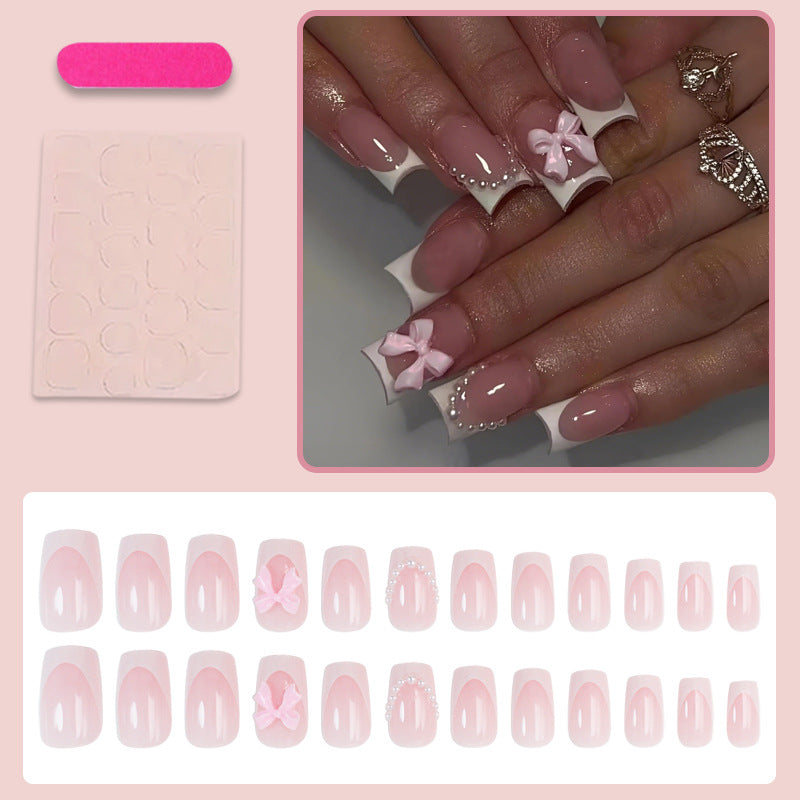 Kunstnagelset mit romantischen Schleifen und eleganten Akzenten Brehn