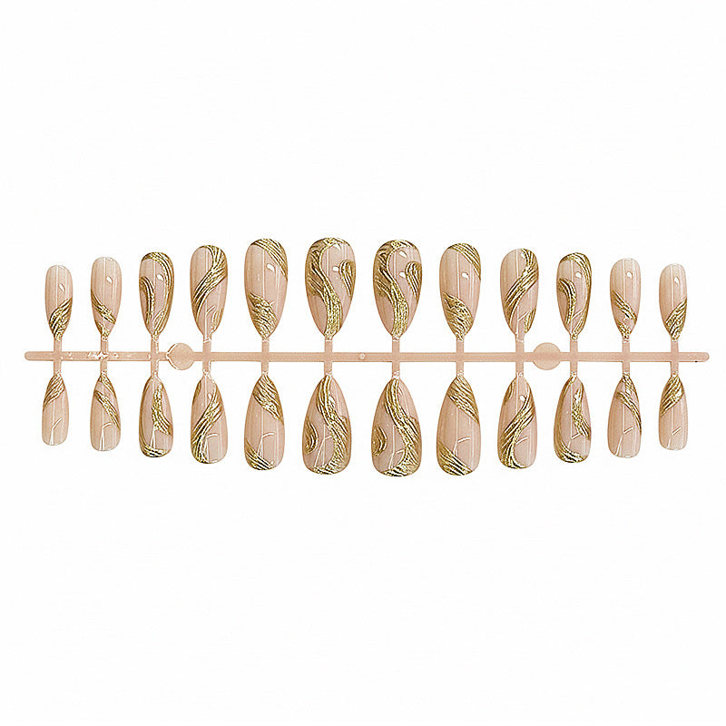 Künstlerisches Press-On Nagelset mit goldener Wirbel-Design Brehn