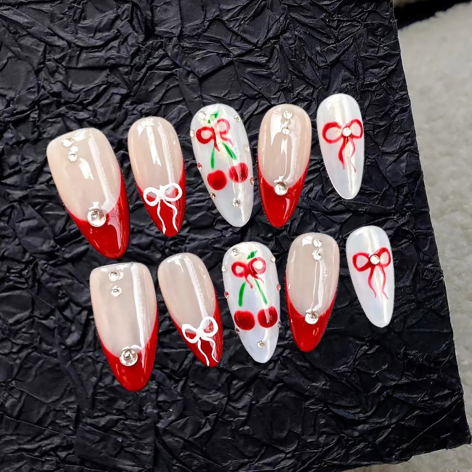 Künstlerisches Press-On-Nagelset mit Kirsch- und Schleifendessin Brehn