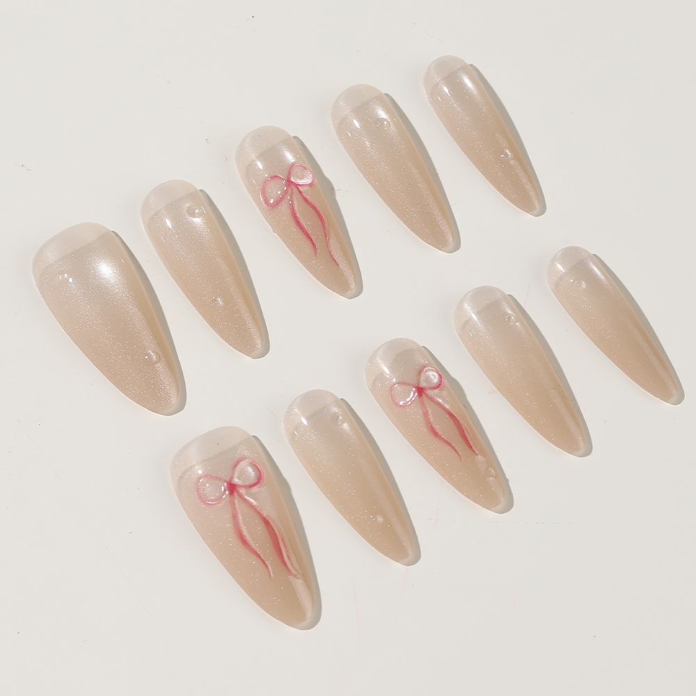 Elegantes Stiletto Press-On Nagelset mit Schleifenakzenten Brehn