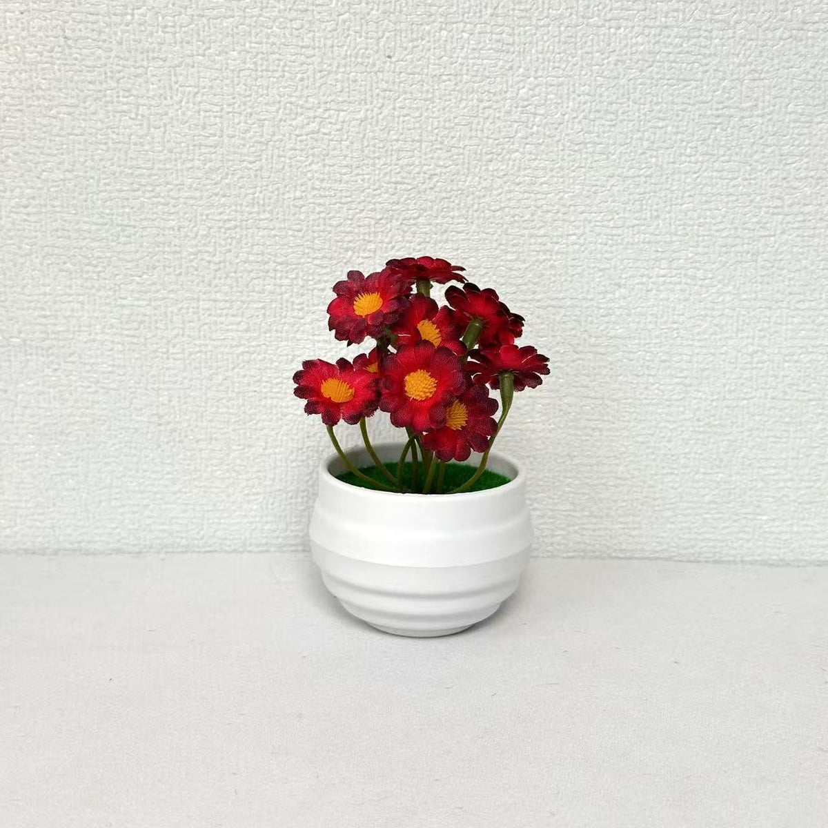 Künstliches Orchideen-Blumenarrangement für die Wohnraumausstellung