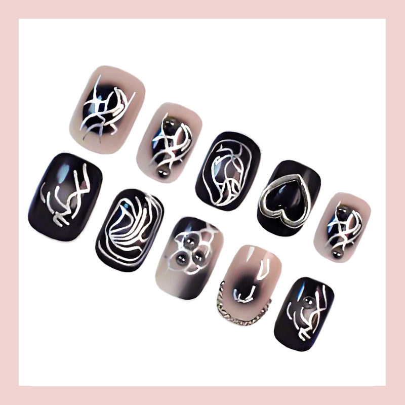 Kunstnagelset mit kreativen Schwarz-Weiß-Mustern Brehn