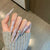 Künstlerisches dekoratives Stiletto Press-On Nagelset mit floralen Akzenten Brehn