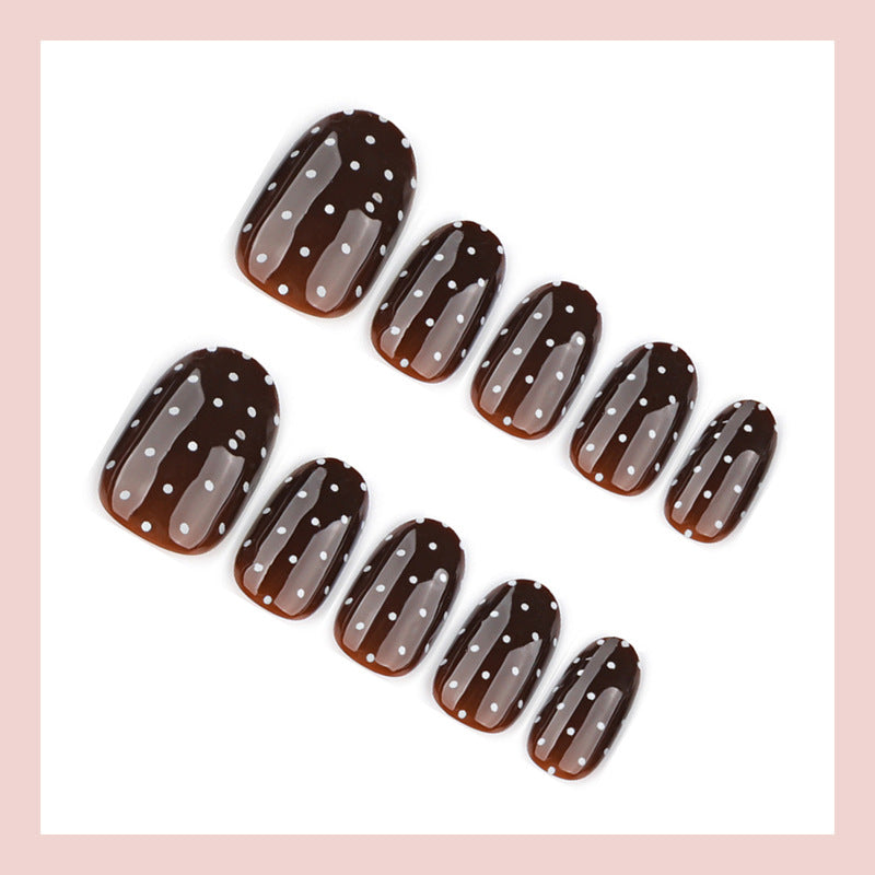 Kunstnagelset mit eleganten Punkten und glänzenden Akzenten Brehn