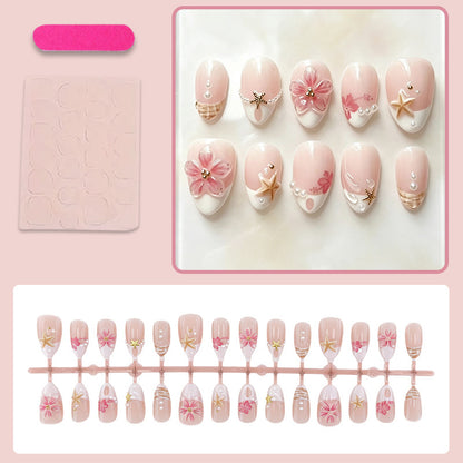 Kunstnagelset mit maritimen Details und floralen Akzenten Brehn