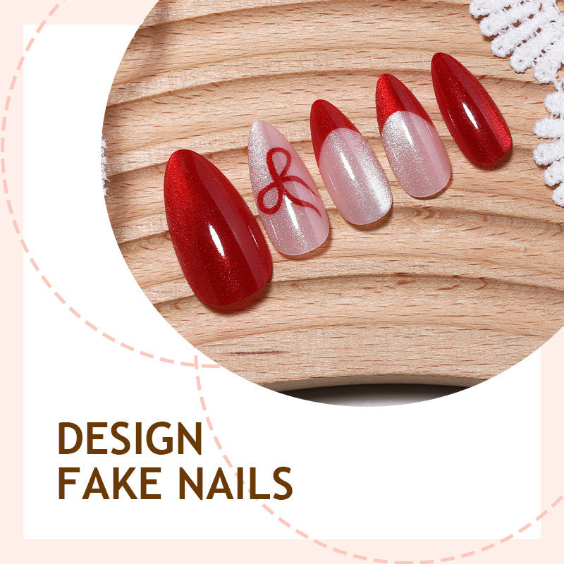 Kunstnagelset mit elegantem Rot und zarten Schleifenakzenten Brehn