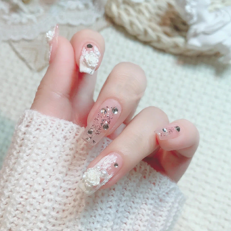 Kunstnagelset mit eleganten 3D-Blüten- und Glitzerverzierungen Brehn
