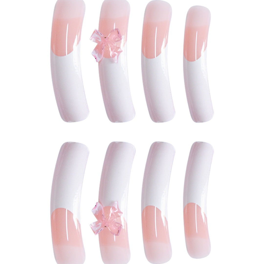 Stylische Acryl Press-On Nagelverlängerungen mit dekorativem Bogen Brehn