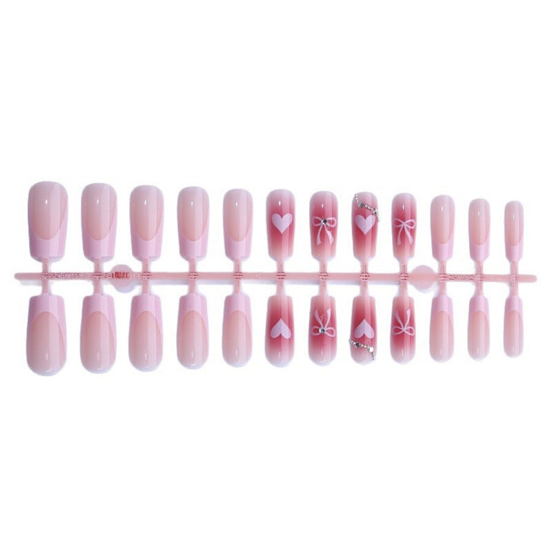 Kunstnagelset mit eleganten Schleifen- und Glitzermotiven Brehn