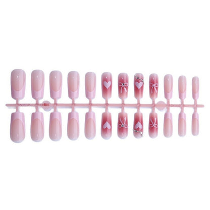 Kunstnagelset mit eleganten Schleifen- und Glitzermotiven Brehn
