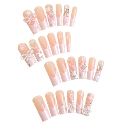 Glamouröses Kunstnagelset mit 3D-Schleifen und Glitzersteinen Brehn