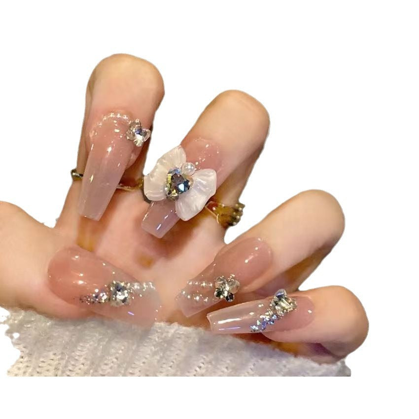 Elegante Kunstfingernägel mit Blumendekor und Glitzer Brehn