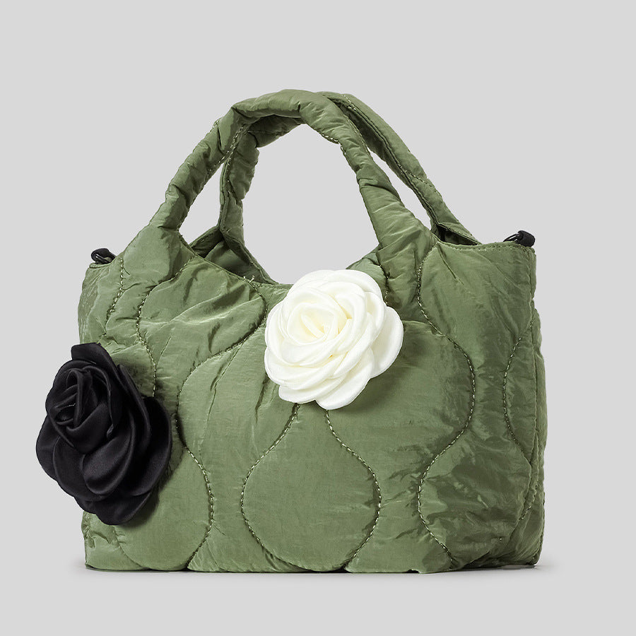 Blumengeschmückte gesteppte Handtasche