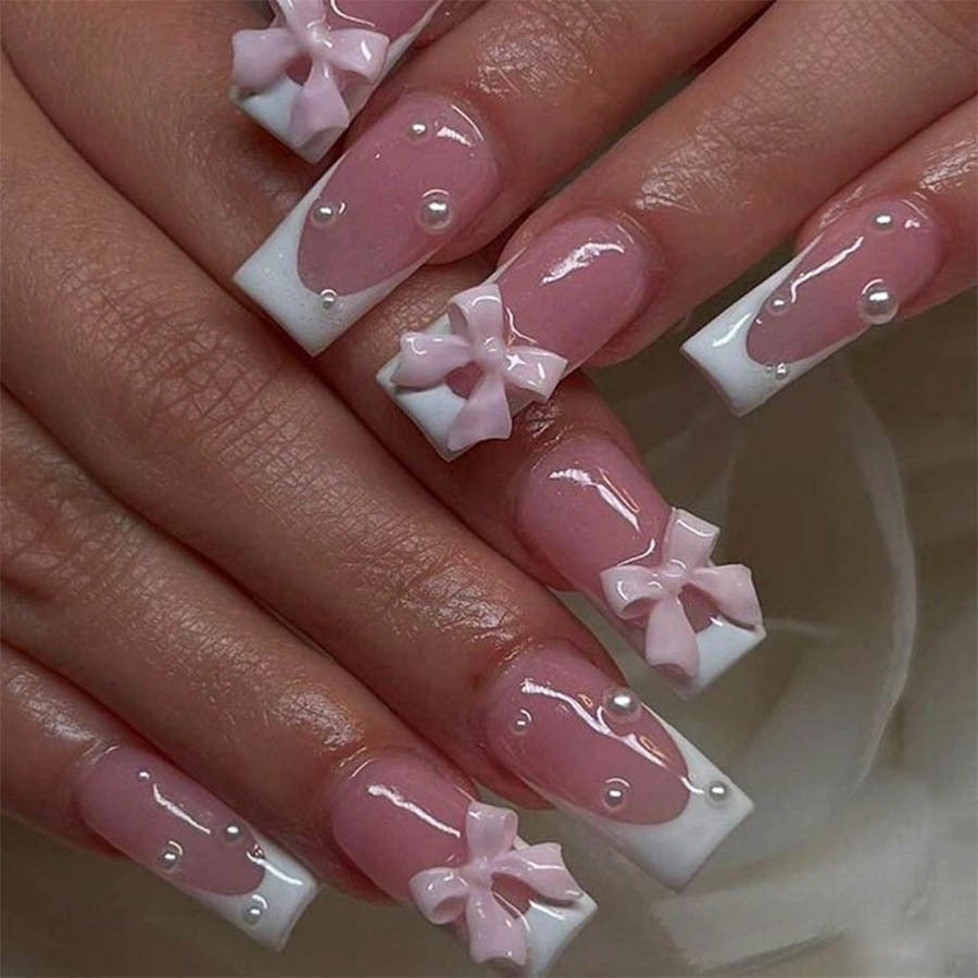 Kunstnagelset mit eleganten Schleifen- und Perlverzierungen Brehn