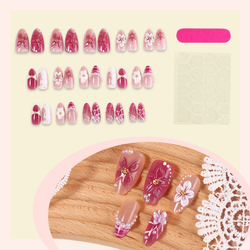 Kunstnagelset mit floralem Design und Glitzerakzenten Brehn