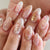 Dekoratives Press-On Nagelkunstset mit floralem Design Brehn