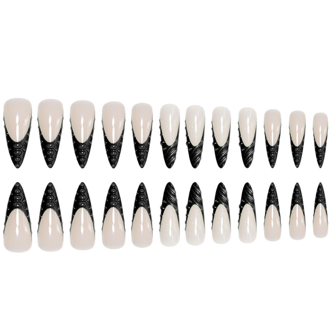 Künstlerische Stiletto-Nagelverlängerungen mit strukturierten Details Brehn