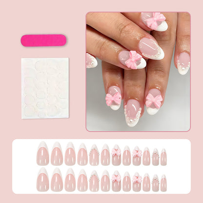 Kunstnagelset mit eleganten Schleifen- und Perlenverzierungen Brehn
