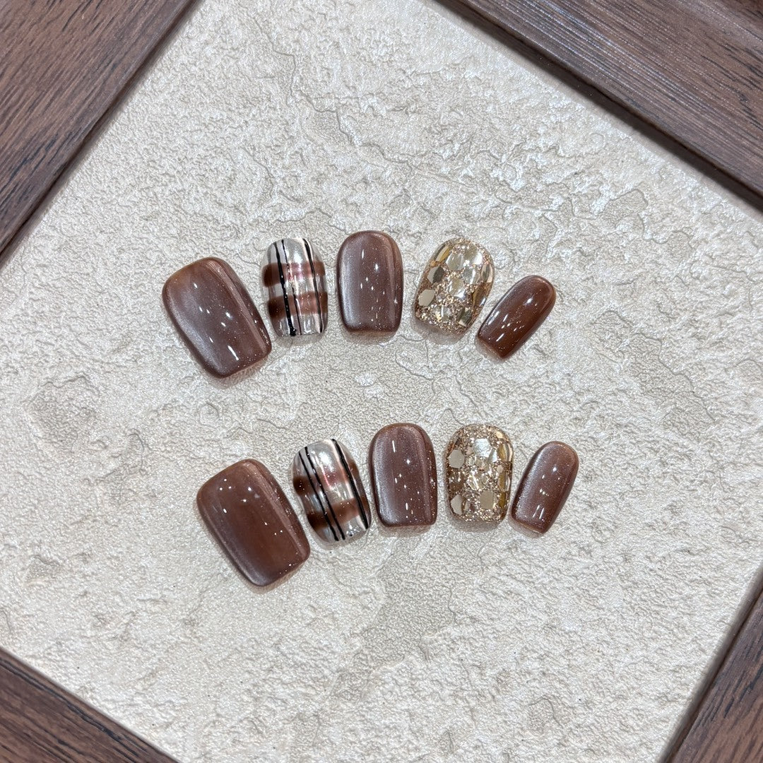 Kunstnägel-Set mit Glitzer- und Goldakzenten Brehn